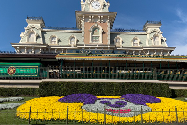 Magic Kingdom train station with Mickey Mouse landscape created with flowers