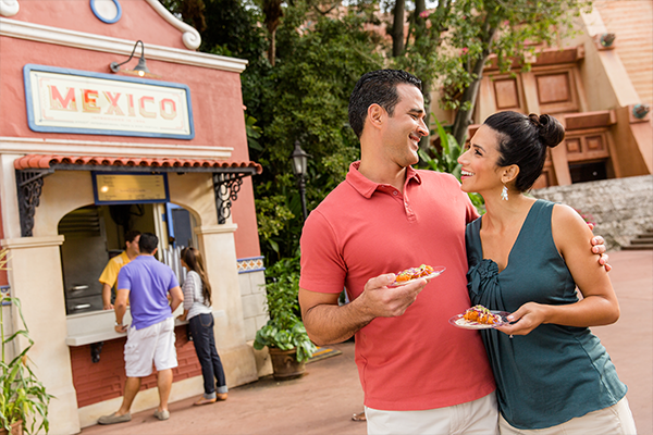 Couple getting food at Mexico pavilion at Disney's food and wine festival