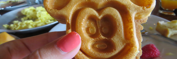 hand holding Mickey Mouse waffle