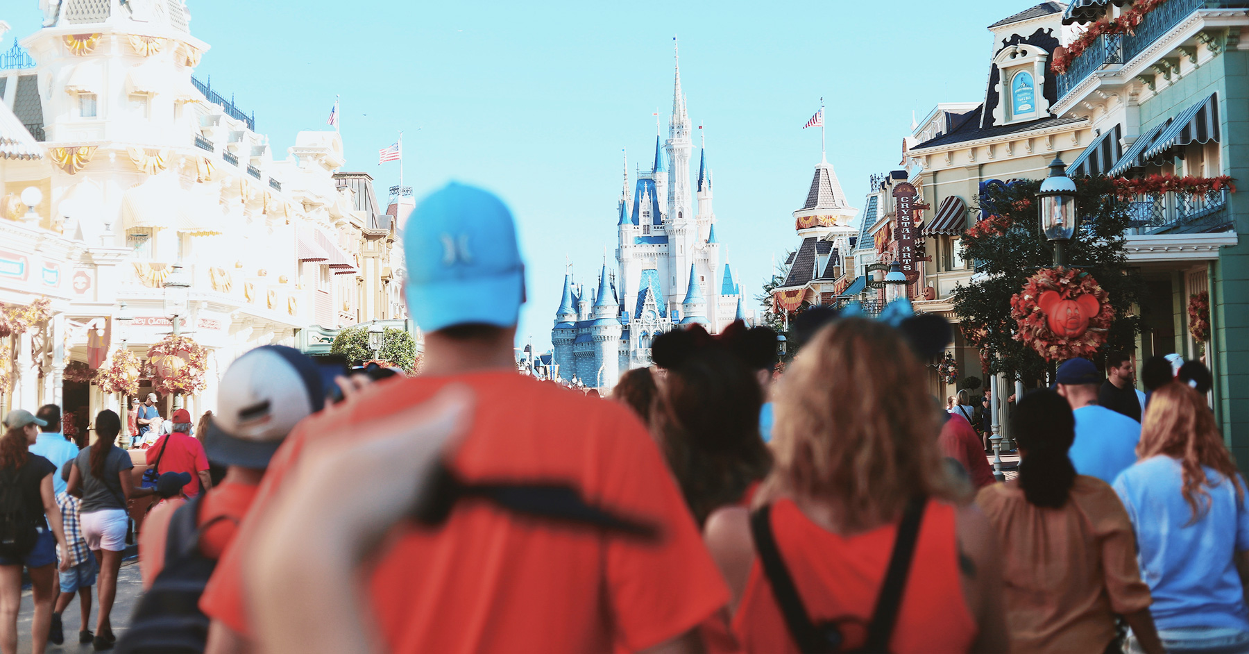 crowd walking down Main Street USA magic kingdom Disney World